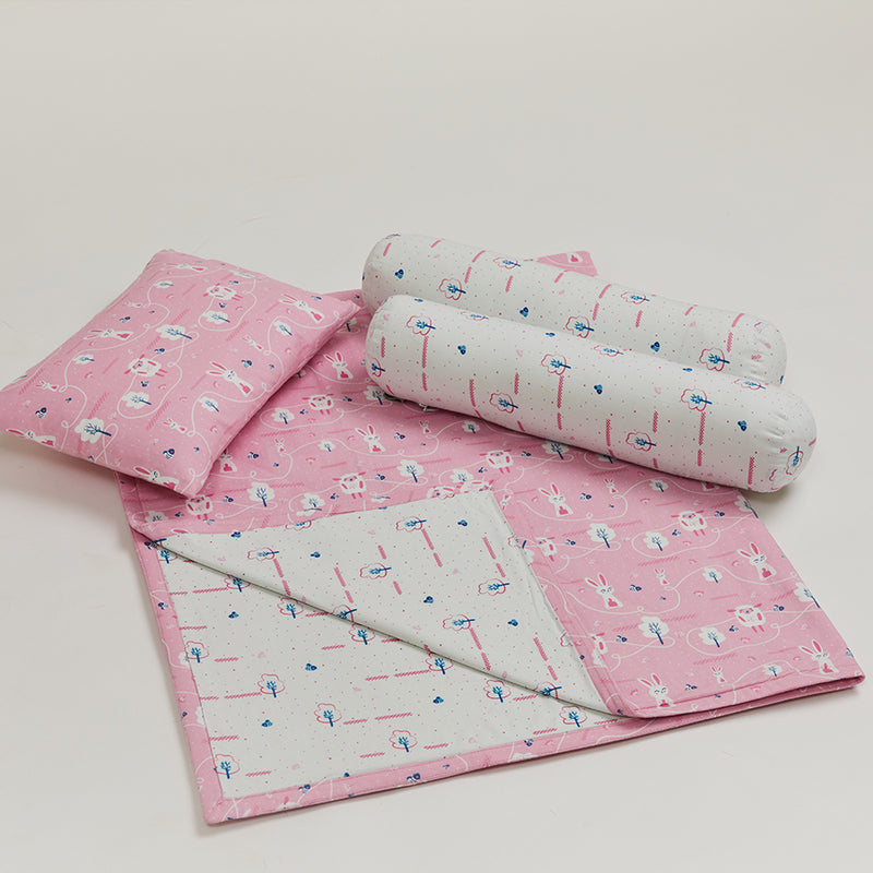 reversible coverlet, made of double-layered breathable cotton, a baby pillow and two bolsters with washable covers